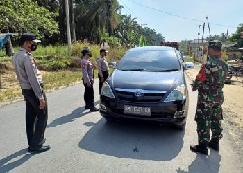 Sebagai Langkah Penanggulangan Covid-19, Kapolsek Kerumutan Awasi Ketat Penerapan Prokes