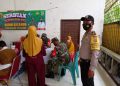 Bhabinkamtibmas Desa Telayap dan TNI Monitor Giat Vaksinasi Dosis II
