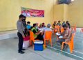 Gencarkan Vaksinasi di Wilkum, Polsubsektor Pelalawan Lakukan Pengamanan di Desa