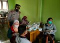 Polsek Pangkalan Kuras Kawal Vaksinasi Hingga Selesai, Situasi Berjalan Kondusif